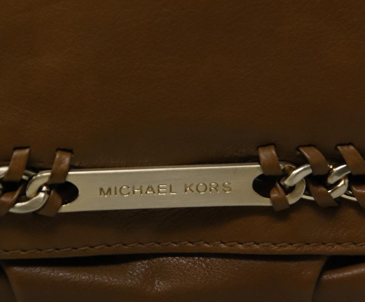 https://www.michaelsconsignment.com/cdn/shop/files/michael-kors-brown-tan-leather-shoulder-bag-with-gold-chain-detail-michael-s-consignment-nyc-7.jpg?v=1702086860